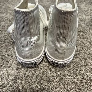 Converse silver  metallic high top tennis shoes